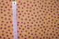 Preview: aprikotfarbener Baumwollstoff mit lila Punkten von Hilco