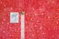 Preview: orangener Batikstoff von Anthology, Motiv: Ovale, Farben: rot-orange