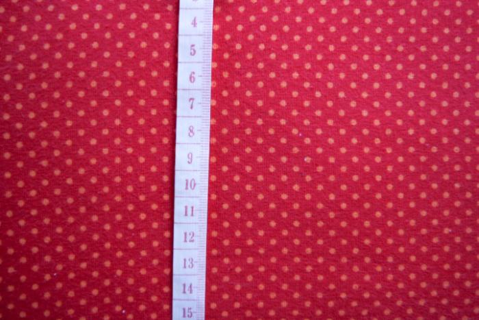 roter Jersey mit orangenen Minipunkten (Abstand der Punkten 0,5 cm) 95% Baumwollstoff und 5 % Elastan